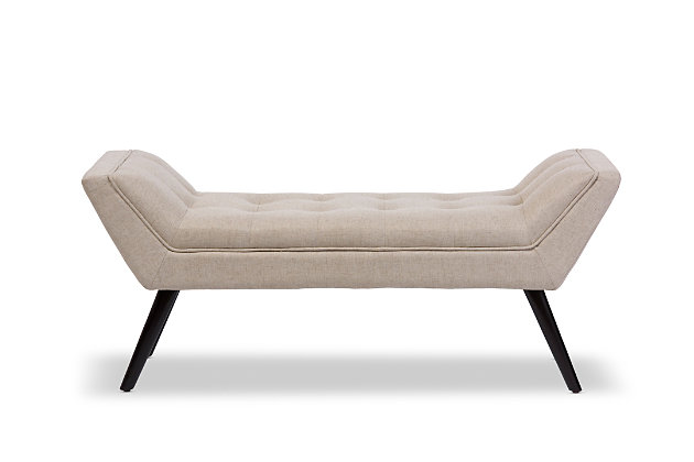 What a striking choice for mid-century modern and fashion-forward spaces. Sumptuously cushioned upholstered bench in beige is sure to make a high-style addition to your home. Fabulous in an entryway or under a window, it’s equally at home at the foot of the bed.Made of wood and engineered wood | Beige linen polyester upholstery | High-density foam cushioning | Tufted seat | Padded feet to prevent marks on flooring | Black finished legs | Some assembly required