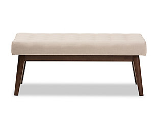 What a stri choice for mid-century modern and fashion-forward spaces. Sumptuously cushioned upholstered bench in light beige is sure to make a high-style addition to your home. Fabulous in an entryway or under a window, it’s equally at home at the foot of the bed.Made of wood | Light beige polyester upholstery | High-density foam cushioning | Button-tufted seat | Walnut-tone legs | Some assembly required