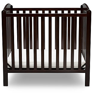 Working with limited square footage? No problem. This Mini Convertible Baby Crib with Mattress from Delta Children delivers the same versatility and style as a full-size crib, just in a scaled-down size. Small but mighty, this crib features a two-position mattress support that can be lowered as your baby grows, plus it easily converts into a twin bed when your child is ready (twin bed frame not included, sold separately). Arched panels on both ends of the crib add charm and make it a great option in small nurseries or grandma’s house. Includes mini-crib mattress.For any questions regarding delta children products, please contact consumersupport@deltachildren.com monday to friday, 8:30 a.m. To 6 p.m. (est) | Made of wood, engineered wood and metal | Includes a 2.75" thick mini-crib mattress, uses 24"x 38" crib sheets (sold separately) | Converts to a twin headboard (bed frame not included, sold separately) | Pair this crib with any delta children pieces in matching colors to complete your baby's nursery | 2 position metal mattress support system | Assembly required