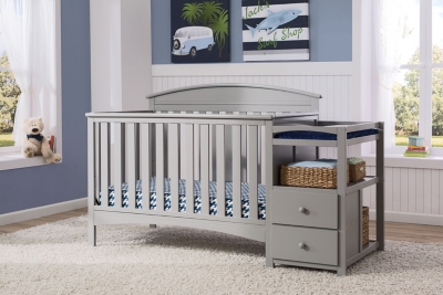 gray baby crib with changing table