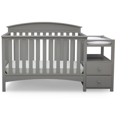 grey crib with changing table