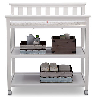 The Flat Top Changing Table with Wheels from Delta Children grants you the freedom to easily change and dress your baby. A convenient changing station, this versatile table has a flat back with slated detailing and a streamlined profile that effortlessly pairs with any item. Outfitted with two fixed shelves to conveniently store your child's essential items, the Flat Top Changing Table also features four casters on the bottom, so you can roll the table from one end of the room to the other. For your baby’s safety, the included changing pad with safety strap keeps your little one secure—even when they won’t stay still.For any questions regarding delta children products, please contact consumersupport@deltachildren.com monday to friday, 8:30 a.m. To 6 p.m. (est) | Made of wood, engineered wood and metal | Strong and sturdy wood construction | Includes two fixed shelves for open storage | Changing pad with safety strap included | Assembly required