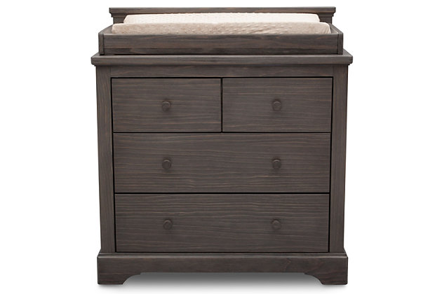 Impressive and substantial, the Paloma 4 Drawer Dresser with Changing Top from Simmons Kids instantly brings warmth to any space. Gorgeously made from strong and sturdy pine, this dresser features a hand-distressed, soft textured finish that makes each piece one of a kind. Built to accommodate your child’s needs, this rustic dresser features a removable changing topper, plus it has two large drawers and two smaller drawers to house all their clothes and accessories. Pair it with the Paloma 4-in-1 Convertible Crib (sold separately) to complete your nursery. Due to varying wood grains and variations in the hand-applied finish, product might appear slightly different than those shown on site.For any questions regarding delta children products, please contact consumersupport@deltachildren.com monday to friday, 8:30 a.m. To 6 p.m. (est) | Made of wood, engineered wood and metal | 4 drawers | Includes removable changing top (changing pad sold separately) | Assembly required