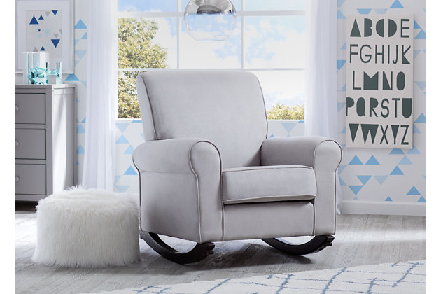 Rock-a-bye your baby in the sumptuous comfort of this upholstered nursery rocking chair. Indulgently soft cushioning, expansive roll arms and a gentle rocking motion make this chair something to cherish. Richly neutral, feel-good microfiber fabric is sure to blend beautifully in your space. Clean, transitional styling looks equally at home alongside contemporary and traditional decor.For any questions regarding delta children products, please contact consumersupport@deltachildren.com monday to friday, 8:30 a.m. To 6 p.m. (est) | Made of wood | Dove gray microfiber upholstery | Wood legs with dark chocolate finish | Attached back and loose seat cushions | Supportive back and padded armrests | Gentle rocking motion | Assembly required