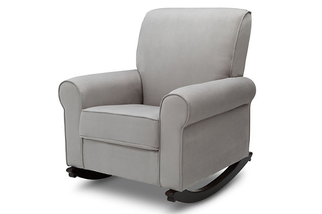 Rock-a-bye your baby in the sumptuous comfort of this upholstered nursery rocking chair. Indulgently soft cushioning, expansive roll arms and a gentle rocking motion make this chair something to cherish. Richly neutral, feel-good microfiber fabric is sure to blend beautifully in your space. Clean, transitional styling looks equally at home alongside contemporary and traditional decor.For any questions regarding delta children products, please contact consumersupport@deltachildren.com monday to friday, 8:30 a.m. To 6 p.m. (est) | Made of wood | Dove gray microfiber upholstery | Wood legs with dark chocolate finish | Attached back and loose seat cushions | Supportive back and padded armrests | Gentle rocking motion | Assembly required