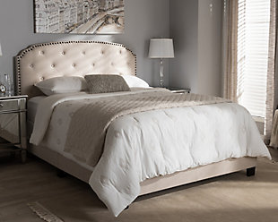 Set the scene for a sweet, chic bedroom retreat with this upholstered bed in beige. Notched edging, button tufting and bronze-tone nailhead trim give the arched headboard a touch of flair and sense of romance you’re sure to love.Made of wood and engineered wood | Polyester upholstery over foam cushioned headboard | Headboard with button tufting and bronze-tone nailhead trim | Assembly required | Assembly required | Foundation/box spring required, sold separately | Mattress available, sold separately