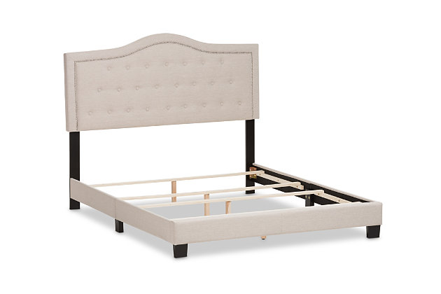 Set the scene for a sweet, chic bedroom retreat with this upholstered bed in beige. Wowing with a scalloped headboard beautified with button tufting, it's the stuff dreams are made of.Made of wood and engineered wood | Polyester upholstery over foam cushioned headboard | Headboard with button tufting | Assembly required | Assembly required | Foundation/box spring required, sold separately | Mattress available, sold separately