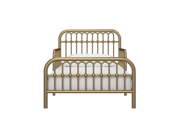 Inspired by classic wrought-iron furniture, the Little Seeds Monarch Hill Ivy metal toddler bed is the perfect size for your growing child. Merging a clean profile with cozy comfort, this toddler bed is high style, sized accordingly. Designed to give them the “big kid” bed they crave while including a few modifications to put you at ease, this bed will have everyone resting easy. Low to the ground profile makes it easy for your little one to get in and out of bed on their own, while the attached guardrails are both pretty and practical. Best of all, your existing full-size crib mattress (sold separately) will fit this toddler bed to a T.Made of metal | Non-toxic goldtone finish | Fits full-size crib mattress; sold separately | Low profile with guardrails on each side | Assembly required