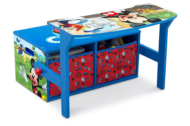 Add the fun-loving charm of Mickey to your home with the Disney Mickey Mouse Kids Activity Bench by Delta Children. An adorable addition to your child’s Clubhouse, this clever activity bench will have your child smiling ear-to-ear when they see the colorful graphics of Mickey, Minnie, Donald Duck and the rest of the lively bunch. Its innovative, 3-in-1 design converts from a bench with storage to a desk in seconds, offering your little Mouseketeer the perfect spot for playtime, study time—even mealtime. Designed as just the right size for a child, the smart construction also features ample storage underneath with two fabric bins—perfect for organizing books, toys or art supplies. Sporting a strong and sturdy wood frame, this piece will inspire years of imaginative play and learning, making any activity more animated!For any questions regarding delta children products, please contact consumersupport@deltachildren.com monday to friday, 8:30 a.m. To 6 p.m. (est) | Made of wood, engineered wood, metal and fabric | Recommended for ages 3 and up | 2 fabric storage bins | Easy assembly