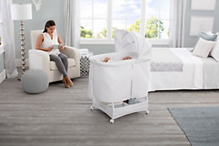 Lull your baby to sleep with the relaxing, automatic gliding movement of the Simmons Kids Silent Auto Gliding Deluxe Bassinet. With a push of a button, the bassinet’s whisper-quiet gliding motion is activated, and the smooth sway of the bassinet will help your newborn drift to sleep peacefully. Outfitted with other electronic features that’ll help Baby power down, this bassinet comes outfitted with preloaded lullabies and sounds, as well as a nightlight—it has everything you need to effortlessly tackle bedtime with your newborn. Built with locking wheels and a lightweight frame to make it easy to move from room to room, this bassinet ensures your little one will have a safe spot to rest in any room of the house—it’s ideal for bedtime or daytime naps with an adjustable canopy that blocks light to create a serene sleep spaceFor any questions regarding delta children products, please contact consumersupport@deltachildren.com monday to friday, 8:30 a.m. To 6 p.m. (est) | Made of metal, plastic and quilted fabric | Holds up to 15 lbs. | Includes fitted sheet, 1" water-resistant pad, music module, nightlight and two plush toys that hang from the canopy | 15-minute intervals of silent, hands-free auto-gliding motion at the push of a button | Ac adapter for battery free operation of glider | 4aa batteries required for the music module and nightlight (not included) | Large storage basket underneath provides ample storage | Locking casters make it easy to move from room-to-room | Jpma certified and meets or exceeds all astm and applicable cpsc standards