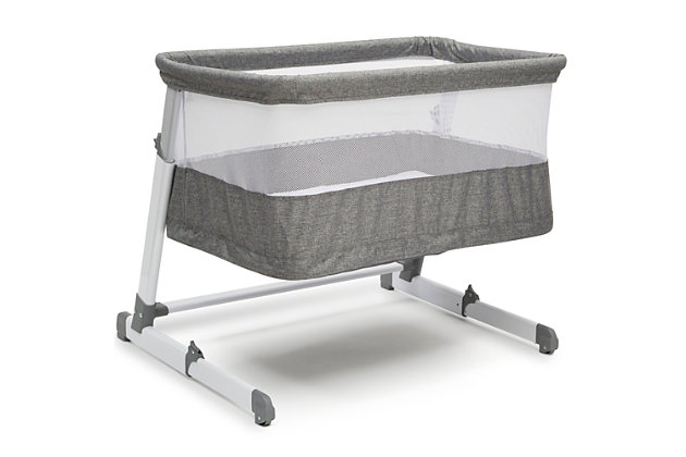Making it extremely easy and safe to room share with your little one from birth to 12 months, the Room2Grow Newborn Bassinet to Infant Sleeper from Simmons Kids—a must-have for new parents—features two stages that allow you to lower the unit as your baby matures. Use the bassinet mode for newborns up to 15 lbs.; you can easily adjust the height so your baby is close by and within reach to make it easier to soothe or feed your little one. For infants up to 25 lbs., use the sleeper mode which allows you to lower the unit to the floor to ensure your growing baby has the safest sleep environment while still being close by. The included mattress pad offers a firm, comfortable surface to sleep on while mesh sides provide a clear view of Baby and help air circulate. It’s the ultimate solution: a space-saver that doesn’t sacrifice safety or design.For any questions regarding delta children products, please contact consumersupport@deltachildren.com monday to friday, 8:30 a.m. To 6 p.m. (est) | Made of metal, plastic and fabric | 2-in-1 design features bassinet mode for newborns up 15 lbs. (0-5 months) and sleeper mode for infants up to 25 lbs. (0-12 months) | Stable frame features adjustable height positions with a sleeper height that’s on the floor to accommodate your growing child | Mesh sides provide a clear view and help air circulate | Included mattress pad cover is waterproof and machine washable | Jpma certified to meet or exceed all safety standards set by the cpsc & astm | Great mini crib, portable crib or pack ‘n play alternative