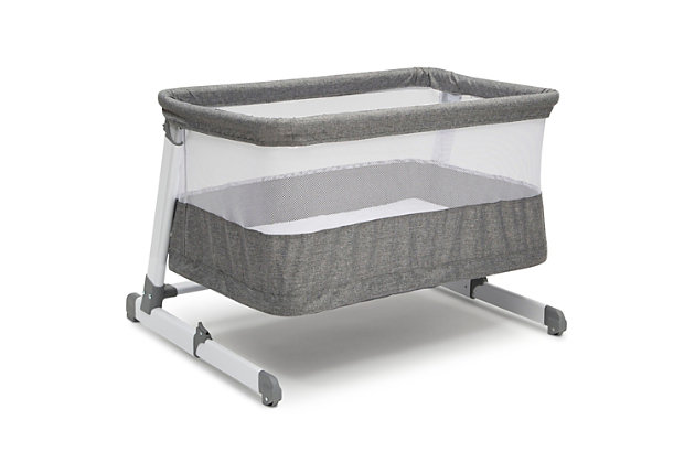 Making it extremely easy and safe to room share with your little one from birth to 12 months, the Room2Grow Newborn Bassinet to Infant Sleeper from Simmons Kids—a must-have for new parents—features two stages that allow you to lower the unit as your baby matures. Use the bassinet mode for newborns up to 15 lbs.; you can easily adjust the height so your baby is close by and within reach to make it easier to soothe or feed your little one. For infants up to 25 lbs., use the sleeper mode which allows you to lower the unit to the floor to ensure your growing baby has the safest sleep environment while still being close by. The included mattress pad offers a firm, comfortable surface to sleep on while mesh sides provide a clear view of Baby and help air circulate. It’s the ultimate solution: a space-saver that doesn’t sacrifice safety or design.For any questions regarding delta children products, please contact consumersupport@deltachildren.com monday to friday, 8:30 a.m. To 6 p.m. (est) | Made of metal, plastic and fabric | 2-in-1 design features bassinet mode for newborns up 15 lbs. (0-5 months) and sleeper mode for infants up to 25 lbs. (0-12 months) | Stable frame features adjustable height positions with a sleeper height that’s on the floor to accommodate your growing child | Mesh sides provide a clear view and help air circulate | Included mattress pad cover is waterproof and machine washable | Jpma certified to meet or exceed all safety standards set by the cpsc & astm | Great mini crib, portable crib or pack ‘n play alternative