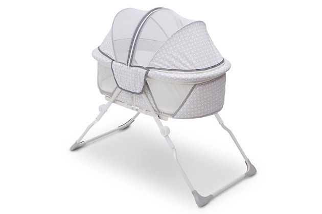 Whether you’re traveling with your baby or in need of a portable sleeper in your home, the EZ Fold Ultra Compact Travel Bassinet from Delta Children makes naptime and bedtime a breeze. The most compact -size bassinet available, this sleeper ensures your baby has the room they need to rest comfortably while the lightweight design means you can travel without trouble. Easy to setup and store away, the bassinet requires no assembly, and folds flat—the included travel bag makes every outing feel stress-free. Designed with mesh panels on the sides for airflow and increased visibility, this travel bassinet provides the ideal environment for rest and relaxation. A removable canopy protects your little one from curious pets, mosquitos and other insects, and then effortlessly zips off when not needed.Birth to five months; holds up to 15 lbs. | Ultra-compact fold down design with an included travel bag for easy transport or storage; no assembly required | Mesh sides provide added ventilation and increased visibility | Removable canopy keeps baby from curious pets, mosquitos and other insects while creating a cozy sleep space | Includes machine-washable mattress pad | Jpma certified to meet or exceed all safety standards set by the cpsc & astm