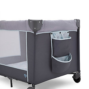 Keep your baby safe, close and comfy with the LX Deluxe Play Yard from Delta Children. You’ll love all the convenient features—a removable bassinet provides the ideal spot for naptime or bedtime while the removable changing table means you’ll always have a sturdy place to change diapers or dress your baby. A detachable storage compartment keeps changing necessities nearby, so you never have to run to another room for diapers or wipes. When your baby outgrows the bassinet, the insert is removable and this piece functions like a full-size play yard. Large mesh sides provide optimal ventilation while also permitting a clear view. Designed to use at home or away, the play yard’s wheels make it super-easy to move around the house, and the quick fold construction and included carry bag make for fuss-free travel. It’s everything you need for a nursery in a portable design.For any questions regarding delta children products, please contact consumersupport@deltachildren.com monday to friday, 8:30 a.m. To 6 p.m. (est) | Made of metal, plastic and fabric | Bassinet up to 15 lbs.; changing table up to 25 lbs.; play yard for children up to 35” tall | Removable, full-size bassinet is perfect for naptime or bedtime | Removable changing table station with waterproof surface | Snap-on hanging storage compartment for diapers, wipes and other toiletries | Removable mobile arm with hanging plush toys engages early visual development | Quick and compact fold; includes carrying bag for fuss-free travel or storage | Two wheels allow for easy movement from room to room | Easy to assemble; no tools required | Jpma certified to meet or exceed all safety standards set by the cpsc & astm