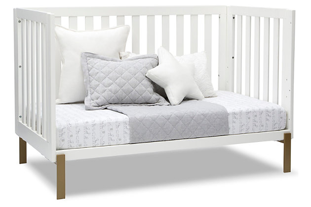 Shake things up in your nursery with the mixed material design of the Hendrix 4-in-1 Convertible Baby Crib by Delta Children. Pine wood construction conveys warmth while the shiny bronze legs add a modern, rock-and-roll flair. Designed to accommodate your growing child, this crib features a three-position adjustable mattress support. You can set the mattress at the highest height for your newborn baby then lower it as he or she begins to sit or stand. Thanks to an easy-to-use guardrail (sold separately), this crib isn’t just a bronzed beauty—it’s the only bed your little one will need. Transform it into a toddler bed when the time is right, and then to a stylish daybed when they’re ready for a little more independence. There’s even room underneath to fit a coordinating storage drawer (sold separately).For any questions regarding delta children products, please contact consumersupport@deltachildren.com monday to friday, 8:30 a.m. To 6 p.m. (est) | Made of wood and metal | Converts to a toddler bed (guardrail not included, sold separately), daybed and sofa | Pair this crib with any delta children pieces in matching colors to complete your baby's nursery | Adjustable height mattress support with 3 convenient positions to grow with your baby | Uses a standard size crib mattress (sold separately) | Assembly required