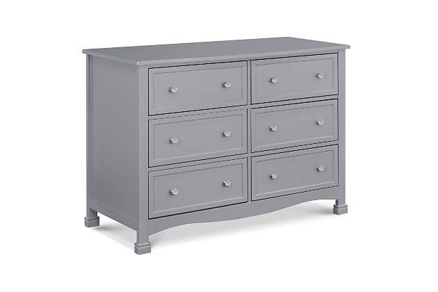 The Kalani 6-drawer dresser is the smart storage solution for the classic Kalani, Emily and Porter nursery collections. Six spacious drawers provide ample storage to organize all of baby’s necessities, while its thoughtful design ensures a style fit for any nursery or bedroom. Brilliant details of this double dresser include recessed front drawer panels, a gently curved apron front and curved top sides.Made of pine wood and TSCA-compliant engineered wood | Wooden drawer knobs | Metal drawer glides with stop mechanisms for added safety; anti-tip kit included | Meets ASTM international and U.S. CPSC safety standards | Finished in non-toxic, multi-step painting process, lead and phthalate safe