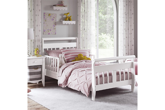 When your child is ready for that exciting move out of the crib, the Baby Relax sleigh toddler bed is the perfect next step. Featuring solid wood construction, this contemporary toddler bed is as playful as it is functional. The Baby Relax sleigh toddler bed is designed low to the ground making it easy for your child to get in and out without any assistance. For added security, two side rails are in place to help prevent falls—leaving you worry-free about their safety. This toddler bed also features a classic sleigh design that is sure to stand the test of time.Made of wood | Sleigh design toddler bed with safety guardrails | Features a modern non-toxic white finish | Includes a soft curved headboard and footboard | Uses a standard size crib mattress (sold separately) | Get the entire playfully sophisticated look by combining the Sleigh toddler bed with the rest of the Baby Relax collection | JPMA certified and meets all CPSC and ASTM safety standards | 1-year limited warranty | For any questions regarding Dorel products, please contact customer service at 1-800-295-1980 | Assembly required