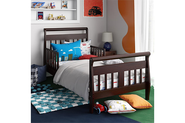 When your child is ready for that exciting move out of the crib, the Baby Relax sleigh toddler bed is the perfect next step. Featuring solid wood construction, this contemporary toddler bed is as playful as it is functional. The Baby Relax sleigh toddler bed is designed low to the ground making it easy for your child to get in and out without any assistance. For added security, two side rails are in place to help prevent falls—leaving you worry-free about their safety. This toddler bed also features a classic sleigh design that is sure to stand the test of time.Made of wood | Sleigh design toddler bed with safety guardrails | Features a modern non-toxic brown finish | Includes a soft curved headboard and footboard | Uses a standard size crib mattress (sold separately) | Get the entire playfully sophisticated look by combining the Sleigh toddler bed with the rest of the Baby Relax collection | JPMA certified and meets all CPSC and ASTM safety standards | 1-year limited warranty | For any questions regarding Dorel products, please contact customer service at 1-800-295-1980 | Assembly required