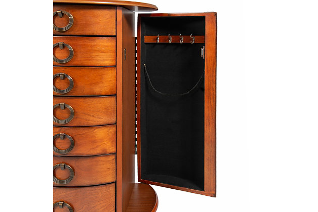 With all the allure of a treasured heirloom—at a fraction of the price—this beguiling jewelry armoire will fit right in. Early American touches such as open ring pulls, Queen Anne feet and plentiful accessory drawers entice, while the rich, cherry-tone finish and lift-top mirror are clear reflections of your good taste.Made of rubberwood, veneer and engineered wood | Cherry-tone finish | Plush black rayon lining | 6 spacious drawers | 2 side storage cabinets | Lift top storage space with mirror | Open circular knobs | Assembly required