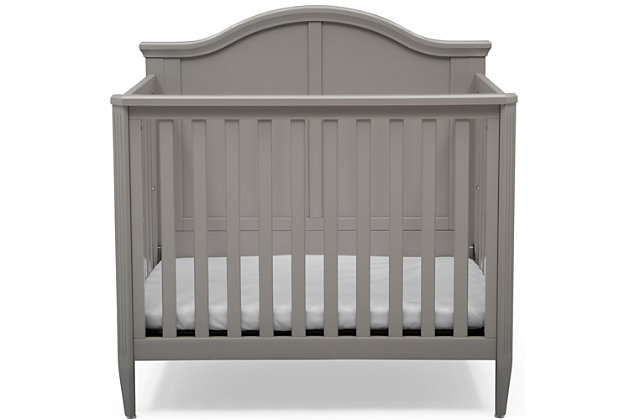 We know not every nursery has an abundance of space, that’s why we created the Delta Children Mini Convertible Baby Crib with Mattress and 2 Sheets set. A timeless silhouette with a bell-shaped headboard and fluted posts, this mini crib offers a classic look in the ideal size for smaller nurseries—without skimping on style, safety or comfort. Small but mighty, this baby crib features a two-position mattress support that can be lowered as your baby grows, plus it easily converts into a twin bed when your child is ready (conversion kit sold separately).Includes mini crib, mattress and 2 fitted crib sheets | Made of wood, engineered wood and metal | Gray finish | 2 fitted crib sheets (light gray, light beige) | Converts from crib to: twin bed with headboard or twin bed with headboard and footboard (bed frame and footboard each sold separately) | Adjustable height mattress support with 2 convenient positions to grow with your baby | Includes mini size crib mattress | Assembly required | Delta children cribs are jpma certified, and are tested above and beyond industry standards | For any questions regarding delta children products, please contact consumersupport@deltachildren.com monday to friday, 8:30 a.m. To 6 p.m. (est)