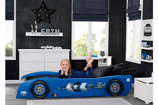Vroom, vroom! Your little racer will be on the road to a good night’s sleep in no time with the Grand Prix Race Car Toddler-to-Twin Bed by Delta Children. This sleek bed resembles a racetrack-ready car with realistic details, like an aerodynamic spoiler, as well as 3D accents and decals that accentuate the headlights, wheels and exhaust. Its grow-with-me design starts out as a toddler bed, then easily converts into a twin bed by inserting four included panels that extend the length and width of the bed. To ensure your child’s safety, the mattress sits low in the bedframe while the sides of the car act as secure guardrails. Take it for a spin today!Toddler to twin bed set | Made of durable molded plastic; easy-to-apply decals included | Converts from toddler to twin bed using the included conversion kit | Toddler version fits standard crib mattress; twin size fits standard twin mattress (each sold separately) | Optional bunky board or box spring sold separately | Built low to the ground to help your little one get in and out of bed; eliminates need for guardrails | Meets or exceeds all cpsia requirements | Easy assembly | Made in the usa | For any questions regarding delta children products, please contact consumersupport@deltachildren.com monday to friday, 8:30 a.m. To 6 p.m. (est)