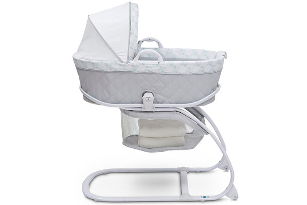 The Deluxe Moses Bassinet from Delta Children is a comfortable sleep space for newborns that combines a Moses basket with a standard bassinet. The adorable Moses basket safely attaches to the bassinet frame, and can be easily removed, so you can keep your baby nearby as you move around the house. To calm your newborn, the attached electronic pod plays peaceful music or emits gentle vibrations while two plush hanging toys attached to the canopy stimulate Baby’s visual senses. A soft nightlight will help you check in on your little one without disturbing them, and an easy-to-reach storage basket keeps blankets, diapers or other supplies nearby. The bassinet’s adjustable canopy offers light-blocking protection for daytime naps. A great first sleep space for your baby, the Deluxe Moses Bassinet from Delta Children is a versatile option that works in your bedroom, the living room, the kitchen, or wherever you may go.Made of plastic, metal and fabric | 2-in-1 design allows use with or without bassinet stand | Includes 1" water-resistant pad and machine washable mattress cover | Electronic pod emits lights, sounds and vibrations; requires 3 aa batteries (not included) | Adjustable canopy with 2 plush hanging toys | Easy-roll wheels for mobility | Storage underneath | Easy assembly (no tools required) | Recommended for ages 0-5 months; holds up to 15 pounds | Jpma certified to meet or exceed all safety standards set by the cpsc & astm | For any questions regarding delta children products, please contact consumersupport@deltachildren.com monday to friday, 8:30 a.m. To 6 p.m. (est)