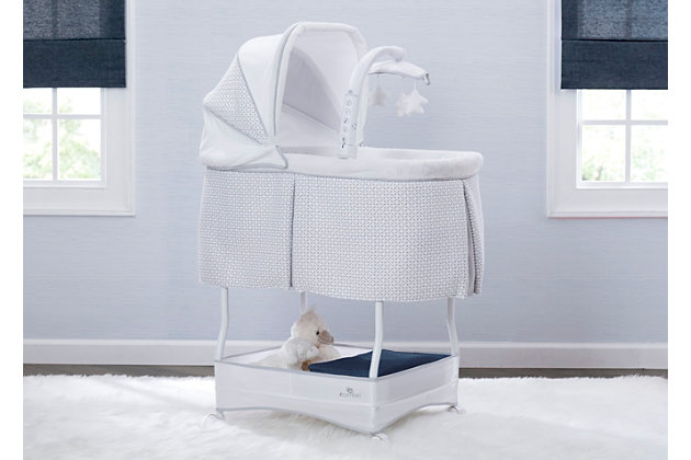 Help ease your baby to sleep with the automatic gliding motion, soothing sounds, spinning star toys, twinkling lights and soft-glow nightlight on the Serta iComfort Auto Gliding Bassinet. Activate the bassinet’s whisper-quiet gliding motion with a push of a button—the smooth sway creates a serene sleep space. The modern grey and white pattern on plush fabrics will be at home anywhere, from the nursery to the family room and the parents' bedroom. Locking wheels, a light-blocking canopy and foam pad means your newborn can sleep by your side, no matter where you are in the house. Plus, the removable fitted sheet is machine washable for easy care. Brought to you by Serta, the leader in mattress innovation and technology, this bassinet will make it easier than ever for baby to fall asleep and stay asleep throughout the night. This bassinet is recommended for babies 0-5 months. Stop use at 5 months or once your infant begins to push up on their hands and knees, whichever comes first. Use the included AC adapter for battery-free operation.Made of plastic, metal and fabric | Includes machine-washable fitted sheet and 1" water-resistant pad | Push button auto-glide motion with ac adaptor for battery-free operation | Attached mobile includes a nightlight, vibrations and twinkle lights with dangling, rotating plush stars | Mobile arm rotates outward, which makes putting in or taking out baby easy | Canopy is removable and adjustable | Large storage basket under frame for your baby essentials | Wheels for easy mobility | Recommended for ages 0-5 months | Assembly required | Jpma certified to meet or exceed all safety standards set by the cpsc & astm | For any questions regarding delta children products, please contact consumersupport@deltachildren.com monday to friday, 8:30 a.m. To 6 p.m. (est)