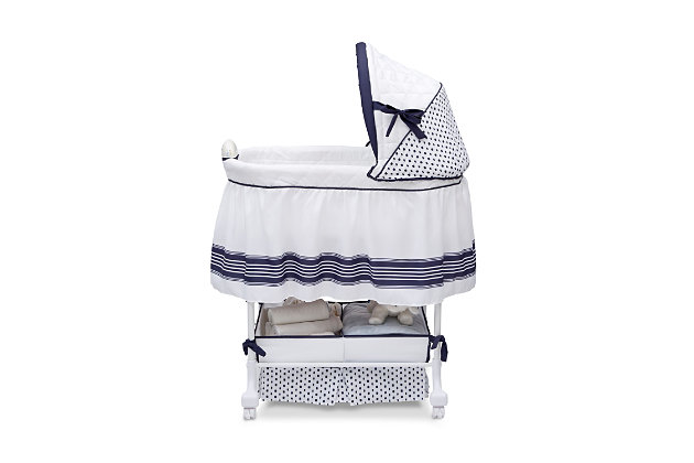 "Ahoy! Your baby will set sail for a good night's sleep with Delta Children's Smooth Glide Bassinet in Marina. Adding a cute coastal touch, this cozy baby bassinet with a crisp blue and white design is outfitted with variable speed vibration, a gentle gliding base, soft nightlight and a music module that comes with preloaded lullabies. Other useful features include locking casters for easy mobility and a large storage basket underneath for all your little one's necessities.Made of metal, fabric and plastic | Gentle side-to-side rocking motion; activate glide motion with a gentle push | Locking caster wheels | Includes 1" mattress and machine washable mattress cover | Electronic pod emits lights, sounds and vibrations; requires 4 aa batteries (not included) | Storage underneath | Recommended use from birth to 5 months (up to 15 pounds) | Assembly required | Jpma certified to meet or exceed all safety standards set by the cpsc & astm | For any questions regarding delta children products, please contact consumersupport@deltachildren.com monday to friday, 8:30 a.m. To 6 p.m. (est)