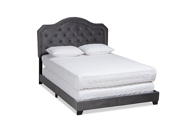 Transform your bedroom in to a glamorous hideaway with this upholstered bed. Constructed from wood, its foam-filled headboard is upholstered in a soft, velvet fabric that provides the perfect spot for you to lean against as you read or watch TV. The headboard’s regal silhouette is further enhanced by silvertone nailhead trim and button tufting. Black tapered feet complete the look.Made of wood, engineered veneer and engineered wood | Velvet polyester upholstery | Foundation/box spring required, sold separately | Mattress available, sold separately | Assembly required
