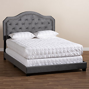 Transform your bedroom in to a glamorous hideaway with this upholstered bed. Constructed from wood, its foam-filled headboard is upholstered in a soft, velvet fabric that provides the perfect spot for you to lean against as you read or watch TV. The headboard’s regal silhouette is further enhanced by silvertone nailhead trim and button tufting. Black tapered feet complete the look.Made of wood, engineered veneer and engineered wood | Velvet polyester upholstery | Foundation/box spring required, sold separately | Mattress available, sold separately | Assembly required