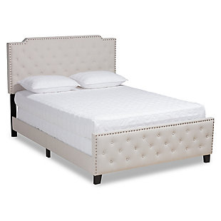 Sweet dreams await with this bed. Crafted with a sturdy wood frame, it’s upholstered in an elegant linen-like fabric and padded with foam for the utmost relaxation. Glamorous silvertone nailheads accentuate the headboard and footboard silhouettes, while button tufting lends a regal look.Made of wood, engineered veneer and engineered wood | Polyester faux linen upholstery with button tufting | Silvertone nailhead accents | Foundation/box spring required, sold separately | Mattress available, sold separately | Assembly required