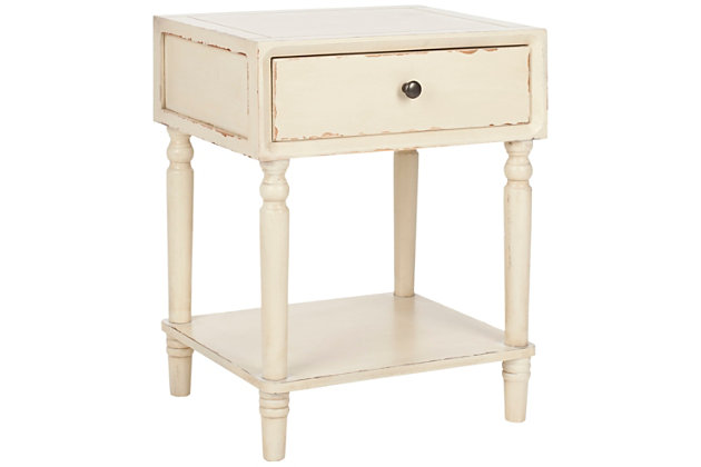 Add a touch of vintage charm with this end table. Bringing just the right amount of storage and country style to the bedroom, living room or even a home office with its clean lines and refined sculptured legs, this table is a pleasant addition to your farmhouse or country cottage aesthetic.Made of poplar wood and zinc | Vanilla lacquer finish | Single drawer | Zinc alloy hardware | Fixed lower shelf | Assembly required