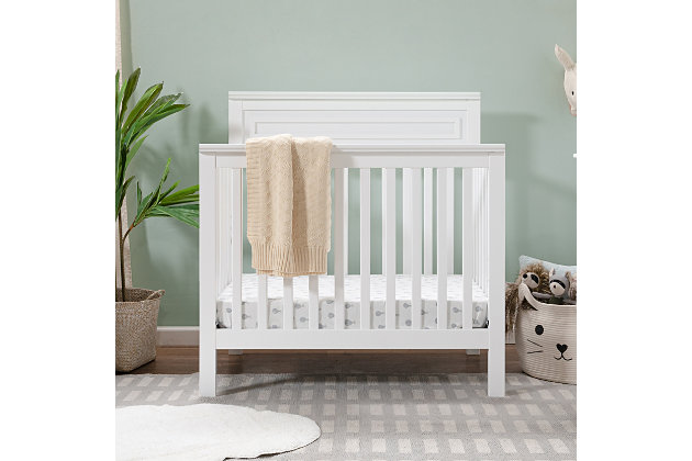 The space-saving design of the Autumn 4-in-1 Convertible Mini Crib will bring both delight and a touch of traditional appeal to any nursery. This mini-sized version of our full-sized Autumn 4-in-1 Crib has the same clean and strong lines with refined raised molding on its high headboard. The Autumn grows with your child with its four different mattress height positions and converts into a mini toddler bed, daybed, and twin-size bed to grow with your child (conversion kits sold separately).GREENGUARD GOLD CERTIFIED: This product has been tested for over 10,000 chemical emissions and VOCs, undergoing rigorous scientific testing to meet some of the world's most stringent chemical emissions requirements. It contributes to cleaner indoor air, creating a healthier environment for your baby to sleep, play, and grow. | 4-in-1 CONVERTIBILITY: Designed to save you the hassle (and extra money!) of buying multiple beds as your little one grows. Easily converts to a mini toddler bed, daybed, and twin-size bed (mini toddler kit #M20399 and twin/full-size kit #M5789 sold separately) | GROWS WITH BABY: 4 adjustable mattress positions that you can lower as your baby begins to sit and stand. We've built this crib to withstand even the most active babies and toddlers and last through your child's teen years | SPACE EFFICIENT: A mini crib is a great alternative for smaller spaces (such as parents' bedroom & smaller apartments) or to store at grandparents' house to make traveling back and forth easy for the whole family | QUALITY MATERIAL: Made of solid sustainable New Zealand pinewood and TSCA compliant engineered wood -only the best for your sweet baby. | BASSINET ALTERNATIVE: The American Pediatric Association recommends co-sleeping for the first 6 months. A mini crib is a more stylish alternative to a pack-n-play and a more long-term solution than a bassinet for keeping your baby closeby as you sleep. | FOR YOUR BABY'S SAFETY: Say goodbye to toxic chemicals! Finished in a non-toxic multi-step painting process and lead and phthalate safe. Rest assured knowing it meets or exceeds ASTM International and U.S. CPSC safety standards | MATTRESS COMPATIBILITY: 1" waterproof pad (24"W x 38"L) included with purchase; for a best fit we recommend a standard mini crib-sized mattress to provide a safe sleeping environment from newborn to beyond 18 months. | COMPLETE THE LOOK: Shop Autumn 4-Drawer Changer Dresser (#M4355), Autumn Bookcase / Hutch (#M4309) and Jayden 6-Drawer Double Wide Dresser (#M5966) for a coordinated nursery