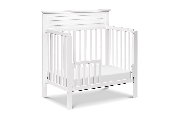 The space-saving design of the Autumn 4-in-1 Convertible Mini Crib will bring both delight and a touch of traditional appeal to any nursery. This mini-sized version of our full-sized Autumn 4-in-1 Crib has the same clean and strong lines with refined raised molding on its high headboard. The Autumn grows with your child with its four different mattress height positions and converts into a mini toddler bed, daybed, and twin-size bed to grow with your child (conversion kits sold separately).GREENGUARD GOLD CERTIFIED: This product has been tested for over 10,000 chemical emissions and VOCs, undergoing rigorous scientific testing to meet some of the world's most stringent chemical emissions requirements. It contributes to cleaner indoor air, creating a healthier environment for your baby to sleep, play, and grow. | 4-in-1 CONVERTIBILITY: Designed to save you the hassle (and extra money!) of buying multiple beds as your little one grows. Easily converts to a mini toddler bed, daybed, and twin-size bed (mini toddler kit #M20399 and twin/full-size kit #M5789 sold separately) | GROWS WITH BABY: 4 adjustable mattress positions that you can lower as your baby begins to sit and stand. We've built this crib to withstand even the most active babies and toddlers and last through your child's teen years | SPACE EFFICIENT: A mini crib is a great alternative for smaller spaces (such as parents' bedroom & smaller apartments) or to store at grandparents' house to make traveling back and forth easy for the whole family | QUALITY MATERIAL: Made of solid sustainable New Zealand pinewood and TSCA compliant engineered wood -only the best for your sweet baby. | BASSINET ALTERNATIVE: The American Pediatric Association recommends co-sleeping for the first 6 months. A mini crib is a more stylish alternative to a pack-n-play and a more long-term solution than a bassinet for keeping your baby closeby as you sleep. | FOR YOUR BABY'S SAFETY: Say goodbye to toxic chemicals! Finished in a non-toxic multi-step painting process and lead and phthalate safe. Rest assured knowing it meets or exceeds ASTM International and U.S. CPSC safety standards | MATTRESS COMPATIBILITY: 1" waterproof pad (24"W x 38"L) included with purchase; for a best fit we recommend a standard mini crib-sized mattress to provide a safe sleeping environment from newborn to beyond 18 months. | COMPLETE THE LOOK: Shop Autumn 4-Drawer Changer Dresser (#M4355), Autumn Bookcase / Hutch (#M4309) and Jayden 6-Drawer Double Wide Dresser (#M5966) for a coordinated nursery