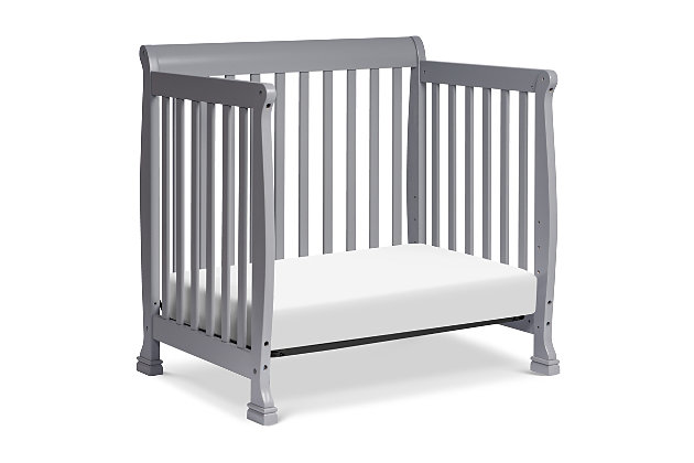 The Kalani Mini Crib is elegance, durability and reliability. Mirroring the Kalani 4-in-1 Crib's timeless design, the Kalani Mini Crib features soft, subtle curves and the same lifetime functionality. Four mattress levels allow you to adjust the mattress height to your child's growth. Beyond the nursery years, the Kalani Mini Crib conveniently becomes a beautiful mini toddler bed, daybed, and -size bed (conversion kits sold separately).GREENGUARD GOLD CERTIFIED: This product has been tested for over 10,000 chemical emissions and VOCs, undergoing rigorous scientific testing to meet some of the world's most stringent chemical emissions requirements. It contributes to cleaner indoor air, creating a healthier environment for your baby to sleep, play, and grow. | 4-in-1 CONVERTIBILITY: Designed to save you the hassle (and extra money!) of buying multiple beds as your little one grows. It easily converts to a mini toddler bed, daybed, and -size bed (mini toddler kit #M20399 and -size kit #M4799 sold separately). | GROWS WITH BABY: 4 adjustable mattress positions that you can lower as your baby begins to sit and stand. We've built this crib to withstand even the most active babies and toddlers and last through your child's teen years | SPACE EFFICIENT: A mini crib is a great alternative for er spaces (such as parents' bedroom & er apartments) or to store at grandparents' house to make traveling back and forth easy for the whole family | BASSINET ALTERNATIVE: The American Pediatric Association recommends co-sleeping for the first 6 months. A mini crib is a more stylish alternative to a pack-n-play and a more long-term solution than a bassinet for keeping your baby closeby as you sleep. | QUALITY MATERIAL: Made of solid sustainable New Zealand pinewood and TSCA compliant engineered wood -only the best for your baby | FOR YOUR BABY'S SAFETY: Say goodbye to toxic chemicals! Finished in a non-toxic multi-step painting process and lead and phthalate safe. Rest assured knowing it exceeds ASTM International and U.S. CPSC safety standards. | MATTRESS COMPATIBILITY: Includes 1" waterproof pad. While this crib fits any standard size mini crib mattress, it best fits with DaVinci’s line of firm comfort, GREENGUARD gold, waterproof mini mattresses. | COMPLETE THE LOOK: Shop Kalani 3-Drawer Dresser & 6-Drawer Dresser for a coordinated nursery