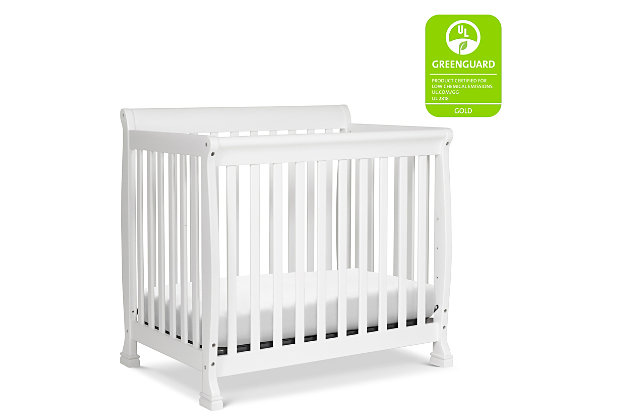 The Kalani Mini Crib is elegance, durability and reliability. Mirroring the Kalani 4-in-1 Crib's timeless design, the Kalani Mini Crib features soft, subtle curves and the same lifetime functionality. Four mattress levels allow you to adjust the mattress height to your child's growth. Beyond the nursery years, the Kalani Mini Crib conveniently becomes a beautiful mini toddler bed, daybed, and twin-size bed (conversion kits sold separately).GREENGUARD GOLD CERTIFIED: This product has been tested for over 10,000 chemical emissions and VOCs, undergoing rigorous scientific testing to meet some of the world's most stringent chemical emissions requirements. It contributes to cleaner indoor air, creating a healthier environment for your baby to sleep, play, and grow. | 4-in-1 CONVERTIBILITY: Designed to save you the hassle (and extra money!) of buying multiple beds as your little one grows. It easily converts to a mini toddler bed, daybed, and twin-size bed (mini toddler kit #M20399 and twin-size kit #M4799 sold separately). | GROWS WITH BABY: 4 adjustable mattress positions that you can lower as your baby begins to sit and stand. We've built this crib to withstand even the most active babies and toddlers and last through your child's teen years | SPACE EFFICIENT: A mini crib is a great alternative for smaller spaces (such as parents' bedroom & smaller apartments) or to store at grandparents' house to make traveling back and forth easy for the whole family | BASSINET ALTERNATIVE: The American Pediatric Association recommends co-sleeping for the first 6 months. A mini crib is a more stylish alternative to a pack-n-play and a more long-term solution than a bassinet for keeping your baby closeby as you sleep. | QUALITY MATERIAL: Made of solid sustainable New Zealand pinewood and TSCA compliant engineered wood -only the best for your baby | FOR YOUR BABY'S SAFETY: Say goodbye to toxic chemicals! Finished in a non-toxic multi-step painting process and lead and phthalate safe. Rest assured knowing it exceeds ASTM International and U.S. CPSC safety standards. | MATTRESS COMPATIBILITY: Includes 1" waterproof pad. While this crib fits any standard size mini crib mattress, it best fits with DaVinci’s line of firm comfort, GREENGUARD gold, waterproof mini mattresses. | COMPLETE THE LOOK: Shop Kalani 3-Drawer Dresser & 6-Drawer Dresser for a coordinated nursery | The american pediatric association recommends co-sleeping for the first 6 months; a mini crib is a long-term solution compared to bassinet | Shop kalani 3-drawer dresser and 6-drawer dresser for coordinated nursery (sold seperately) | Assembly required