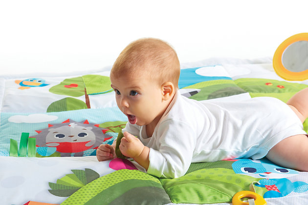 Give your baby extra room to play and explore with the Tiny Love Super Mat. The Super Mat is truly super-sized and features a variety of engaging activities to encourage your baby’s development with each area providing different types of stimuli to encourage motor skills: from a crinkly fox tail to an engaging peek-a-boo tree and more. This variety of textures, images and toys provides baby with a space to be entertained as they learn important developmental skills. The extra-large size of the mat is great for play dates with plenty of room for two. The Super Mat is also a cozy place for bonding with baby and has a removable mirror that is perfect for helping you to extend tummy time. Easy to fold and carry, the Super Mat is great to take on the go and is designed for both indoor and outdoor use.EXTRA ROOM FOR FUN – The extra-large play mat features a developmental playground of fun activities and discovery for baby, all built onto comfy plush padding to keep baby and parent comfortable. | FUN AT HOME OR ON THE GO – Folds easily into a compact size that makes it perfect for taking along to the beach, the park, or wherever the day takes you! | PLAYFUL TEXTURES – Features fun and engaging textures for tactile and motor skill development. | PROMOTE FACIAL RECOGNITION – Soft padded mirror on play mat promotes facial recognition and continuous engagement.