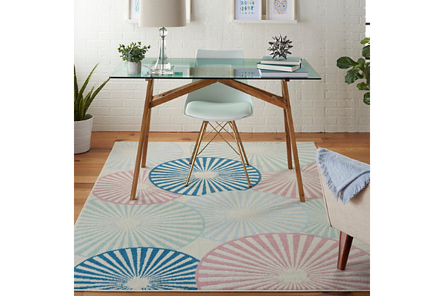 Beautifully bold and gorgeously graphic, the grafix collection of area rugs from nourison is destined to deliver a transfixing touch of dramatic appeal to any room. Available in an enthralling array of contemporary color palettes and power-loomed from long-lasting, easy-care polypropylene, each exciting rug is all about outstanding ease and sensational style. An array of overlapping orbs create captivating energy and vibrance in this grafix area rug. Radiating circular patterns in soft blue, white, and pink adorn an ivory field in a burst of contemporary flair.Serged edges | Low shedding | Indoor only