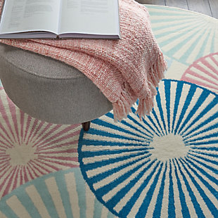 Beautifully bold and gorgeously graphic, the grafix collection of area rugs from nourison is destined to deliver a transfixing touch of dramatic appeal to any room. Available in an enthralling array of contemporary color palettes and power-loomed from long-lasting, easy-care polypropylene, each exciting rug is all about outstanding ease and sensational style. An array of overlapping orbs create captivating energy and vibrance in this grafix area rug. Radiating circular patterns in soft blue, white, and pink adorn an ivory field in a burst of contemporary flair.Serged edges | Low shedding | Indoor only