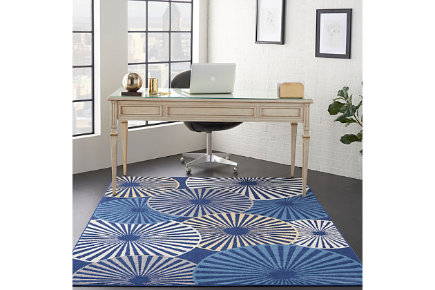 Beautifully bold and gorgeously graphic, the grafix collection of area rugs from nourison is destined to deliver a transfixing touch of dramatic appeal to any room. Available in an enthralling array of contemporary color palettes and power-loomed from long-lasting, easy-care polypropylene, each exciting rug is all about outstanding ease and sensational style. An array of overlapping orbs create captivating energy and vibrance in this grafix area rug. Radiating circular patterns in soft blue, white, and beige adorn a deep navy field in a burst of contemporary flair.Serged edges | Low shedding | Indoor only