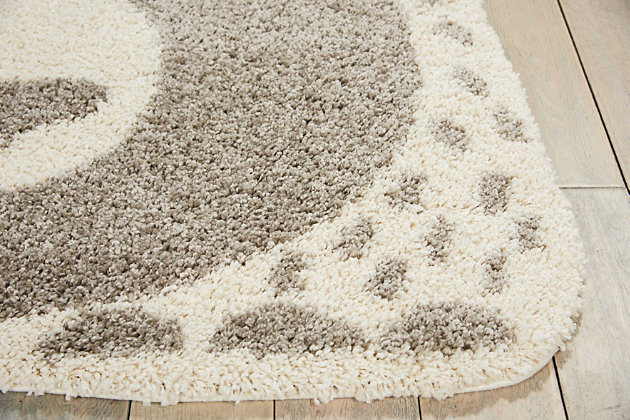 Wonderfully whimsical, the hudson collection of area rugs from nourison is expertly power loomed to bear up beautifully in areas that get lots of action. With its enchanting designs, engaging color palettes, and marvelous textures, hudson will charm and delight for years to come. This hudson area rug from nourison brings a warm, whimsical feel to your home, with a friendly bear peering up at you in silvery gray and ivory shag. Each rug is expertly power loomed to bear up beautifully in areas that get lots of action.Serged edges | Low shedding | Indoor only | Vacuum regularly. Clean spills immediately by blotting with a clean damp sponge or cloth. Professional cleaning recommended.
