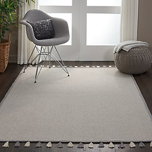 Casual style and easy decor come to life with the otto collection of flat weave rugs from nourison. Ivory is beautifully interwoven with stylish contemporary hues and finished with an ornately bound edge and tassels. The reversible, lightweight construction makes these rugs ideal for any setting in your home. This grey colored otto collection rug from nourison offers a casual accent for any space in the home. The flat weave reversible constructions makes the rug easy to position, and works wonderfully as layered rug option or a standalone area rug. Tasseled fringe give each rug a touch of exotic elegance.Reversible | Low shedding | Indoor only | Vacuum regularly. Clean spills immediately by blotting with a clean damp sponge or cloth. Professional cleaning recommended.