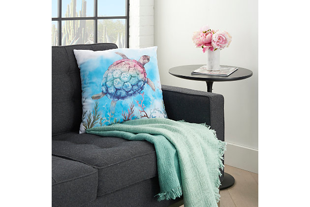 These brilliant handcrafted pillows are destined to brighten your day and enliven your outlook. Featuring jubilant prints, vibrant hues and festive detailing, such as rhinestones, beading and fade-resistant embroidery, this charismatic collection is an exciting embellishment to any outdoor dcor. Enjoy the mystery of sea life with this colorful pillow from the mina victory collection. Handcrafted tie-dye technique creates beautiful watery effects in a graphic depiction of a saltwater turtle floating gracefully among seaweed fronds. Perfect for indoor or outdoor in a comfortable 18” square made from poly canvas fabric with blow fill.Indoor/outdoor | Spot clean | Blow fill | Handcrafted