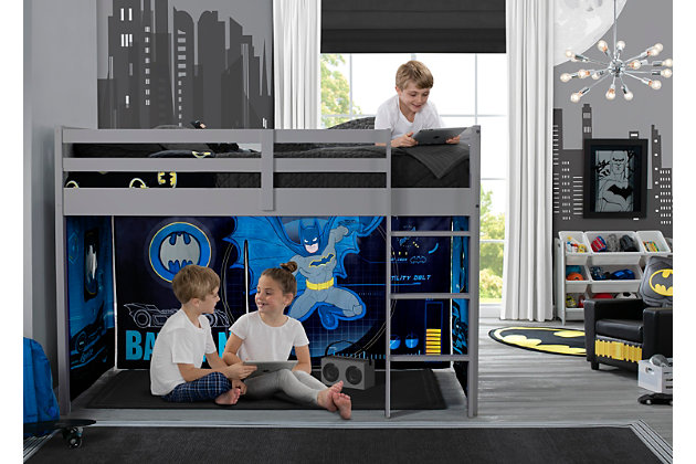 Transform your child’s twin loft bed into fun play area with this Batman Loft Bed Tent by Delta Children. Adding an under-bed tent is an excellent way to create a private space for your child to relax, explore imaginative playtime or complete their homework without needing additional floor space, it can also keep toys neatly out of sight. Boasting colorful graphics of Gotham City’s most popular superhero, these fabric tent panels feature a peek-a-boo mesh window and convenient roll-up front that can be held open with toggles to give a Batcave feel. Incredibly versatile, the front panel can be placed on the front of the bed to create a tented play space or to the back of the bed for a cool, character backdrop—either option allows little ones to enter a world of endless creativity. The Batman Twin Loft Bed Tent by Delta Children is designed to fit the Delta Children Low Twin Loft Bed (sold separately) or any other low loft bed with an opening of 37”H. Easily attach the under-bed tent using Velcro. Tent dimensions: 75"L x 36.5"W x 37"H (37" clearance from bottom of loft bed to floor).About Batman: Dark Knight. Caped Crusader. Sworn protector of Gotham City. Batman goes by many names, but he has only one mission-become the world's greatest weapon against crime. His powers? Super-sophisticated gear and intelligence. Batman's utility belt and Batmoblie help him morph him into the ultimate vigilante. Made to KA-POW, Batman furniture from Delta Children adds cool style to your child's space while creating a fun crime-fighting ambiance that's perfect for pretend play.Unique play space: this batman loft bed tent instantly creates a play space or remote learning area under your child’s bed without taking up additional floor space, tent features a mesh window and roll-up front panel, bed not included | Easy to attach: easily attach the tent to your bed using velcro, front panel of the tent can be placed on the front of the bed or the back for versatility, tent is removable and machine washable | Helps facilitate learning and development: this tent creates a private space for boys or girls to play and explore, imaginative play helps enhances social, cognitive and emotional development | Dimensions: tent size: 75"l x 36.5"w x 37"h, this character tent perfectly fits delta children’s low twin loft bed (sold separately) or any other low twin loft bed with a 37”h opening | Sturdy construction: made from high quality polyester, this character tent stands up to years of play | Features a mesh window and roll-up front panel