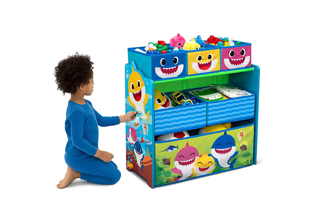 Take a bite out of playroom clutter with this Baby Shark Design & Store 6 Bin Toy Storage Organizer by Delta Children. A storage essential and colorful sticker station and all in one, this toy organizer is boldly decorated with jaw-dropping Baby Shark graphics and includes reusable vinyl stickers that feature a fun under-the-sea theme. Kids can rearrange the stickers on the sides of this organizer for hours of endless storytelling, adding a much-needed incentive to clean-up time. The sturdy wooden frame holds six fabric bins sized for every type of toy, so you can store books, blocks, and more. An eye-popping addition to their playroom or bedroom, this toy organizer makes cleaning quick and easy. About Baby Shark: Baby Shark and his best friend William take fun-filled comedic adventures in their community of Carnivore Cove, meeting new friends and singing catchy tunes along the way. Baby shark, doo, doo, doo, doo, doo, doo.Age range: recommended for ages 3+, safe design: bin meets or exceeds all safety standards set by the cpsc | For baby shark fans: toy bin features colorful graphics of baby shark, mommy shark, daddy shark, grandma shark and grandpa shark, will encourage your child to keep their space neat and tidy | Reusable stickers: kids will love arranging the reusable vinyl cling stickers to the sides of this organizer to create a new story every time they play | Tons of storage: toy bin has 6 bins in varying sizes to fit a wide variety of toys, from small to large, durable construction: made of engineered wood, solid wood and fabric | Size: assembled dimensions: 24.61”l x 11.81”w x 26.57”h, three medium bins: 7.75”l x 9.5”w x 5”h, two large bins: 11.6”l x 9.5”w x 5”h, one extra-large bin: 23.5”l x 9.5”w x 9.5”h, easy assembly