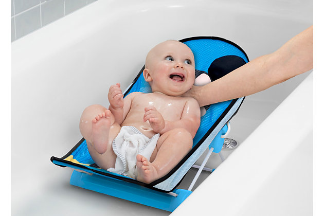 Made for mini Mouseketeers, this Disney Mickey Mouse Baby Bather by Delta Children provides a safe place to bathe your newborn. The bather’s soft mesh material is gentle on baby’s delicate skin and is easy to clean—the slightly inclined design ensures your baby is in a secure position throughout bath time. Mickey’s 3D ears provide needed head support and an extra dose of fun. Use it in your sink or bath tub. The bather’s compact fold is convenient for storage or travel.Recommended use: ideal for infants 0-6 months, holds up to 20 lbs., use this bather until baby is sitting up unassisted | Fits in sinks and bath tubs: great alternative to bulky baby bath tub, this bather easily fits in your sink or tub without taking up a lot of space, assembled dimensions: 13"w x 22"l x 12"h | Supportive design: mickey's 3d ears and bow cradle baby's head and provide needed support, the bather's incline keeps baby in a secure and comfortable position during bath time
needed support, the bather’s incline keeps baby in a secure and comfortable position during bath time | Easy to clean: the soft mesh material is gentle on baby's delicate skin and easy to clean | Compact fold for storage and travel: bather easily folds so you can store in any space or take on trips, folded dimensions 13"w x 14"l x2.5"h