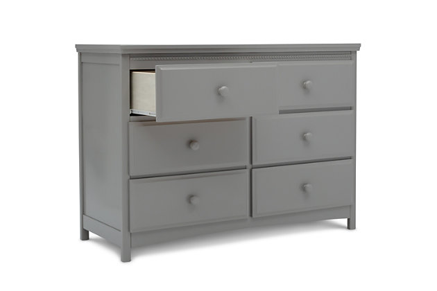 Classic styling and pearl detailing give the Emerson 6 Drawer Dresser by Delta Children a timeless quality. Equipped with six sliding drawers that feature safety stops to prevent the drawers from falling out, this dresser offers a wealth of storage space. Its beautiful finish will never go out of style, while its sturdy wood construction makes it as durable as it is attractive. Round drawer pulls provide a charming finishing touch. A great piece for the nursery, your kid's bedroom or your master bedroom, The Emerson is the smart choice for storage in any space. The Emerson 6 Drawer Dresser is part of the Emerson nursery collection. Pair with the Emerson 4-in-1 Convertible Crib for a coordinated look. Coordinating collection pieces each sold separately. All Delta Children dressers and chests meet the requirements of ASTM F2057, the voluntary industry tip over standard for dressers. For your children's safety, only purchase dressers that comply with this standard. For additional security, Delta strongly recommends that all dressers in your home be anchored; all Delta dressers include a wall anchor. To learn how to properly secure your dresser, please see the product assembly instructions or visit our website.6 drawers offer plenty of storage space | Drawers feature metal drawer guides with safety stops for years of worry-free use | Strong & sturdy wood construction | Engineered and tested to meet astm furniture safety standards; tested for lead and other toxic elements to meet or exceed astm safety standards; includes tipover restraint | Assembled dimensions: 47.50" w x 20.25" d x 34" h | Assembly required | For any questions regarding delta children products, please contact consumersupport@deltachildren.com monday to friday, 8:30 a.m. To 6 p.m. (est)