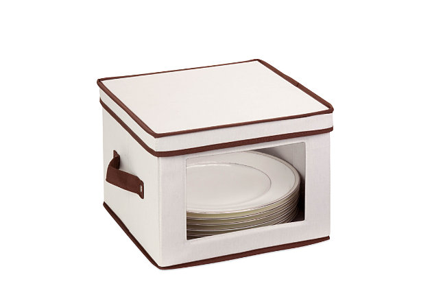 Store up to 12 standard-sized dinner plates in this 12x12 inch storage box. The clear view window lets you easily see the contents while the lift off lid simplifies access. Protective inserts help safeguard against chips or scratches. Remove the dinnerware inserts and this storage box turns into a great closet organization tool. Store scarves, ties, socks, gloves, or hats. In classic off-white with brown accents, this stackable storage box will instantly upgrade any pantry or closet. Made of polyester and cotton canvas.Clear view window | Sturdy construction | Includes dinnerware protectors