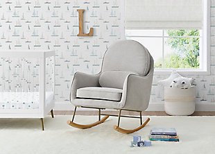 Add a stylish and sustainable seat to your nursery (or any other room in the house!) with this Ella Rocker by Delta Children. Upholstered in LiveSmart Evolve fabric, it brings together three incredible qualities to create a superior performance fabric: recycled fibers, water repellency, and stain resistance. Made with at least 30% of high-quality polyester yarn created from recycled post-consumer plastic bottles, this durable fabric helps divert plastics from landfills. Plus, it’s as comfy and beautiful as it is good for the environment. Designed with modern rounded curves, a metal base and solid wood feet, this rocking chair includes a movable lumbar cushion for additional support. The perfect choice for busy families, its stain-resistant and moisture repelling abilities make it the smart choice for high traffic areas like the nursery or living room. Now, you can live worry-free from stains or spills AND be a part of positive change! Pair with the coordinating Ella Ottoman to complete the look. Available in Limestone, Stone Gray and Slate Blue. Delta Children was founded around the idea of making safe, high-quality children's products affordable for all families. They know there's nothing more important than safety when it comes to your child's space. That's why all Delta Children products are built with long-lasting materials to ensure they stand up to years of jumping and playing. Plus, they are rigorously tested to meet or exceed all industry safety standards.Gentle rocking motion: durable steel and wood construction to ensure quiet movements as you  rock with your baby; felt strip on the rocker base  protects your floors; use this glider in your nursery, living room, master bedroom or man cave | Livesmart evolve fabric: this rocker brings together 3 incredible qualities to create a superior performance fabric: recycled fibers, water repellency, and stain resistance; made with 30% polyester yarn created from recycled post-consumer plastic bottles; livesmart technology allows spills to bead up, sitting on top of the fabric until you gently blot them away | Design accents: lumbar back cushion for added support; modern metal and wood rocking base adds timeless style to any space | Super comfortable: armrests and seat cushion are thickly padded for comfort; seat cushion features pocketed coil spring construction for long lasting comfort and support; seat cushion is removable for easy cleaning | Size/sturdy build: sturdy wood frame provides stability; tested for safety and expertly crafted for durability; assembled dimensions: 25.75"w x 37.75"d x 39.5"h; seat: 20.75"w x 20.25"d x 18.25"h from floor; seat cushion: 4.5" thick; seat back: 25"h