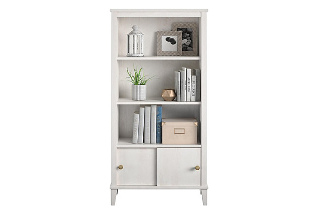 It’s what every little bookworm dreams of – a kids’ bookcase to house all their favorite picture books and bedtime stories easily within their short reach – the Little Seeds Monarch Hill Poppy Kids’ White Bookcase! Made of laminated MDF and particleboard with an Ivory Oak woodgrain finish, this adorable kids’ bookcase features three open shelves for storing all their favorite books and toys, two of which are adjustable to your preferred height. The two sliding door fronts on the bookcase’s bottom cubby give your little one a bonus storage space for their secret treasures, and we’ve included two different sets of knobs so you can customize the kids’ bookcase to your personal style. The Little Seeds Monarch Hill Poppy Kids’ White Bookcase will not only be a charming addition to your kids’ bedroom décor, it just might be the very thing to catalyze your little scholar’s lifelong love of reading. For added peace of mind, the kids’ bookcase meets or exceeds the CPSIA Juvenile testing requirements and comes with a wall anchor kit to ensure your child’s safety. Little Seeds not only creates this and many more on trend kids’ furniture pieces, we also partner with the National Wildlife Federation’s Garden for Wildlife program to help save the Monarch butterfly.Made of laminated mdf and particleboard | Includes 2 knob choices to customize the cubby’s sliding doors to your personal style | Each shelf and the lower concealed cubby can hold up to 35 lbs. Each. a wall anchor kit is included to ensure your child's safety | 1 year limited warranty. assembled dimensions: 54.92h x 27.44w x 12.76d